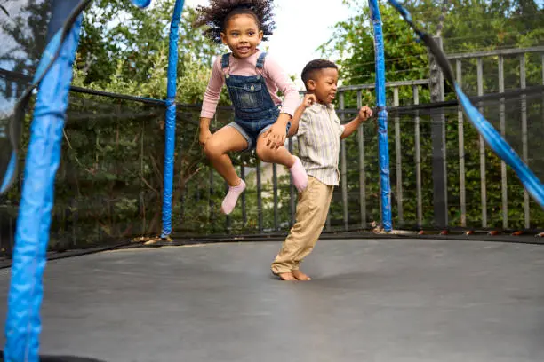 Kids jumping on trampoline