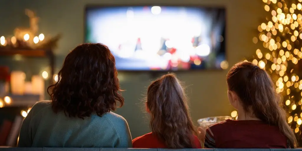 parent watching movie with teen child