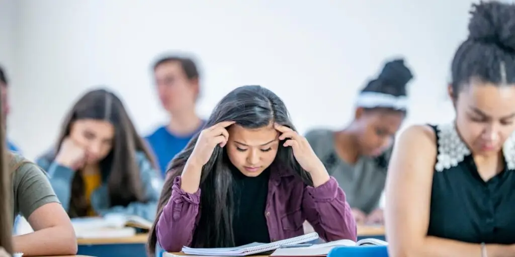 teen struggling with academic pressure