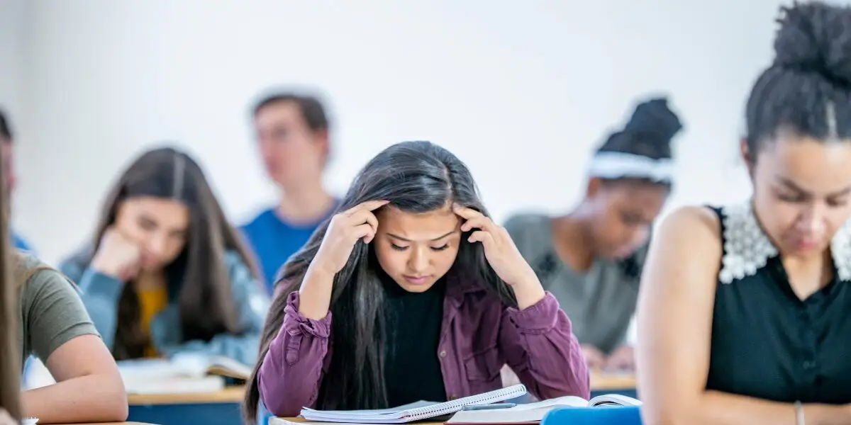 teen struggling with academic pressure